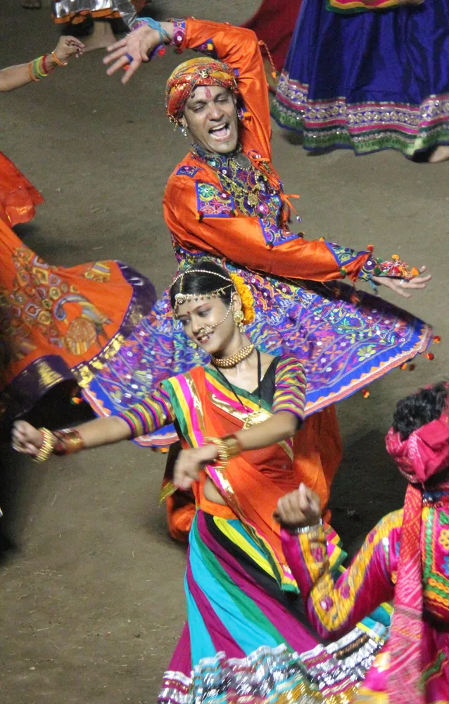 Garba dancers in colourful traditional clothing at a Navratri celebration in Vadodara