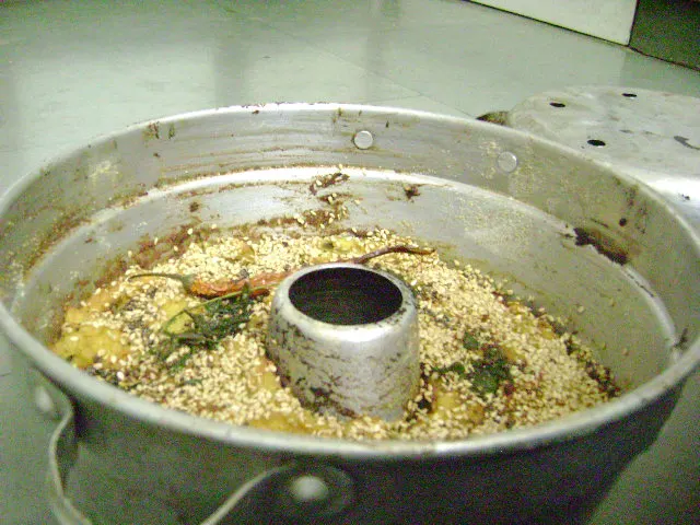 Handvo, a Gujarati savoury cake, in a round baking tin