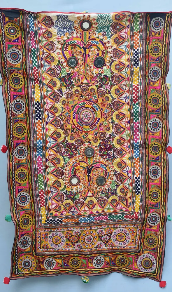Colourful Ahir embroidery textile from Kachchh with mirrors and dense stitched motifs